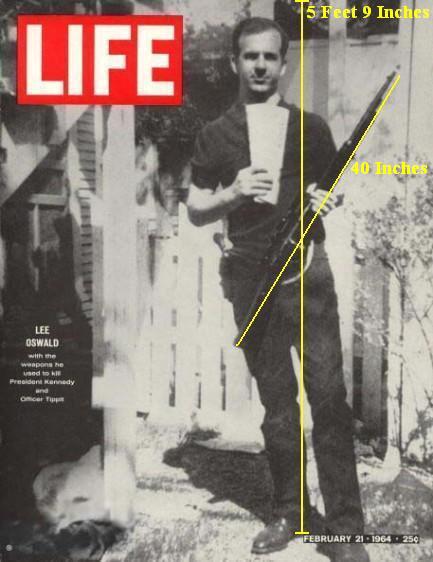 Lee Harvey Oswald holding rifle